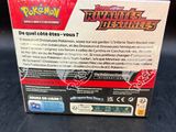 a box of pokemon trading cards on a table