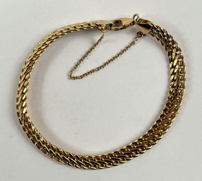 Bracelet en or 750 millièmes, à maille gourmette. - Photo 1