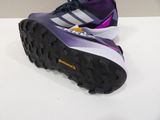purple and white adidas running shoes on a white surface