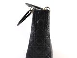 a close up of a black purse on a white background