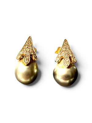 pair of pearl and diamond earrings on a white background