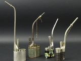 three different types of toothbrushes and a toothbrush holder on a table