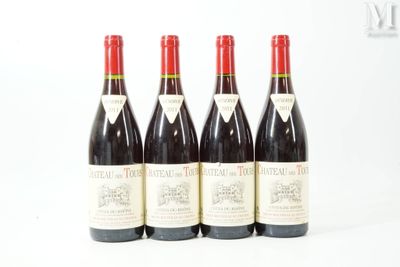 four bottles of red wine are lined up on a white surface
