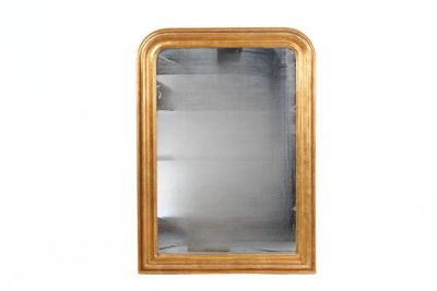an image of a gold framed mirror on a white wall