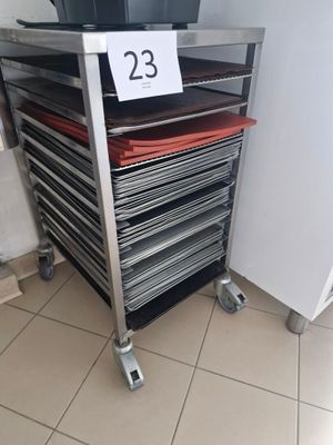 a metal cart with a lot of trays on it