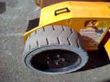 a tire that is sitting on the ground next to a machine