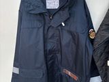a coat hanging on a wall next to a coat hanger