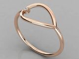 a rose gold ring with a diamond in the middle