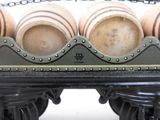 three large pots sitting on top of a train car