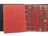 an open red folder with coins in it on a white background