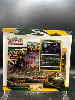 two pokemon trading cards in a display case on a black surface