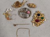 a lot of gold and silver jewelry on a table