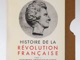 an old book with a picture of a woman ' s face on it
