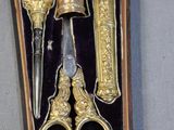 a box with a pair of scissors and a pair of scissors in it