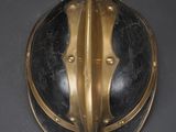 brass helmet on a black background