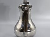 silver plated salt and pepper shaker on a white surface