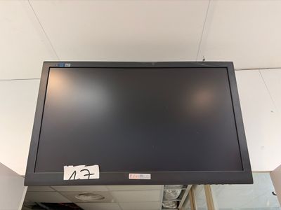 a flat screen tv mounted on the wall in a room