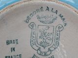 a close up of a plate with a coat of arms on it