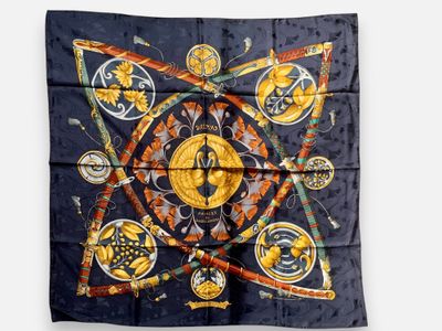 silk scarf with an image of a sun and symbols on it