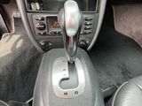 a car dashboard with a gear stick in the center of it