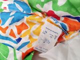 a close up of a colorful fabric with a price tag on it