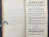 a book open on a table with a key in it