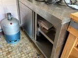 an image of a kitchen with a lot of clutter on the floor