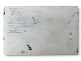 an old envelope with a stamp on it sitting on top of a white surface