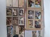 a wall full of old postcards and pictures on the wall