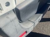 a close up of the rear end of a white truck