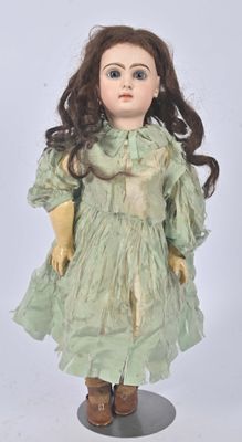 an image of a doll with long hair wearing a green dress and gloves