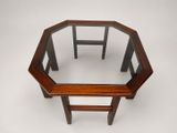 an octagonal table with a glass top and wooden legs