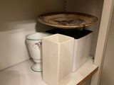 a shelf with a bowl and a plate on it