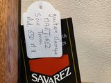 a tag that says savarez on it hanging from a wooden pole