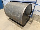 a close up of a metal drum sitting on top of a cement floor