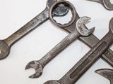 a lot of wrenches that are laying on a table