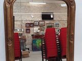a mirror that is sitting on a table in a room