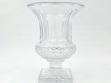 a clear glass vase sitting on top of a table
