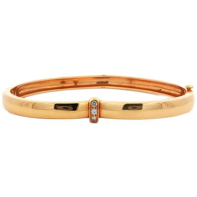 an image of a gold bang bracelet with diamonds