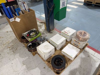 many boxes of electrical equipment on the floor in the store