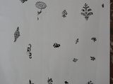 a piece of paper that has a drawing of flowers on it