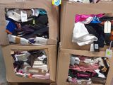 two boxes of clothes sitting on top of each other