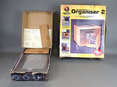 an open box with an electronic organiser inside of it