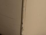 a close up of the bottom of a beige couch