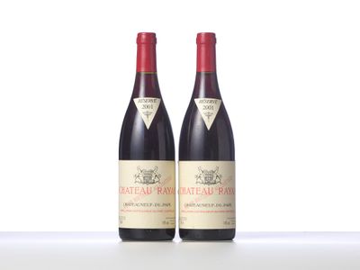 two bottles of red wine sitting next to each other on a table