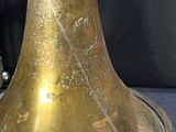 a brass bell that is sitting on a table
