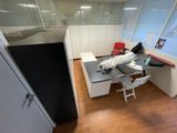 a room with a desk and a chair in it