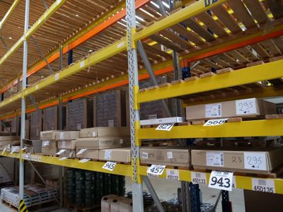 many shelves with boxes and boxes on them in a warehouse