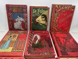 six books of the harry potter series are lined up on a table