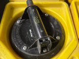 a yellow container with a black handle and a yellow container with a black handle